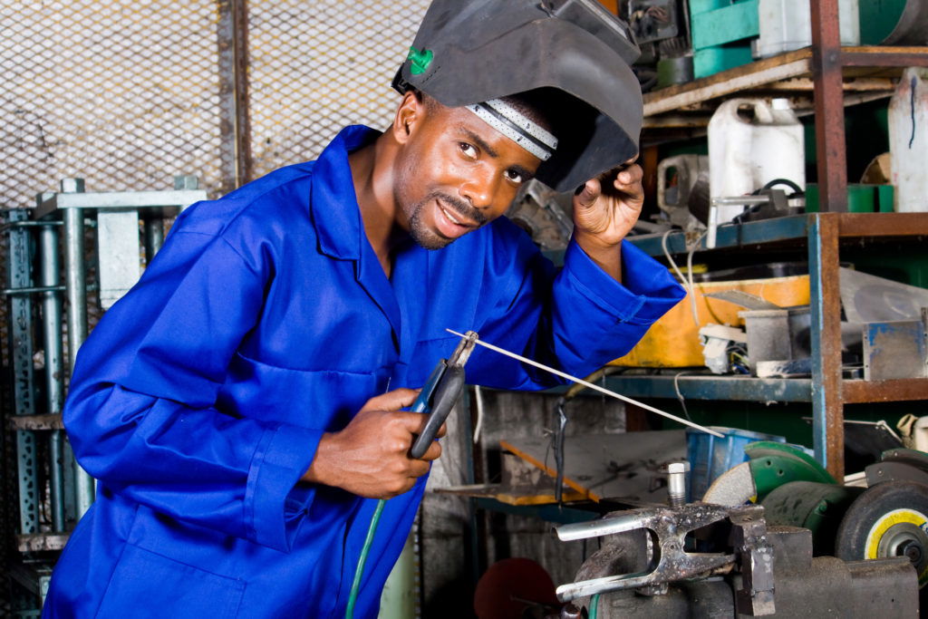 Welder working on metal work